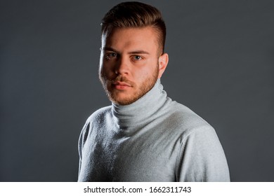 Trendy Modern Young Man Dressed In Trendy Wool Polo Neck Jumper