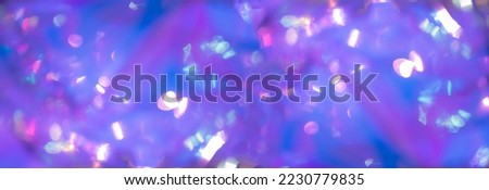 Trendy neon pink purple blue colored backdrop. Blurred glittered background. Perfect for designers.
