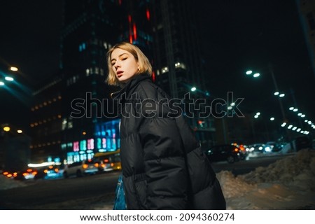 Similar – Image, Stock Photo Young woman in urban setting during springtime