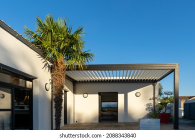 Trendy Outdoor Patio Pergola Surrounded By Landscaping. Shade Structure With Awning And Patio Roof And Aluminium Grill.