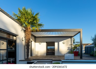 Trendy Outdoor Patio Pergola Surrounded By Landscaping. Shade Structure With Awning And Patio Roof And Aluminium Grill. 