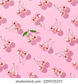 Trendy pattern composition made with Decorative disco balls like cherries on pastel pink background. Concept of minimal entertainment. Flat lai. Contemporary style. Creative art, minimal aesthetics.