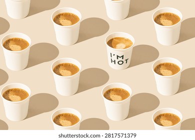 Trendy pattern made of coffee on beige background. Creative coffee concept. Hot drink idea. Unique espresso to go backdrop image.