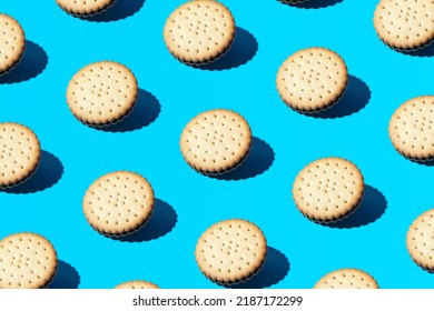Trendy pattern made of old fashioned sandwich cookies on bright blue background. Minimal coffee snack concept.  - Shutterstock ID 2187172299