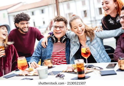 Trendy People On Genuine Fun Moment At Fancy Pub Restaurant - Life Style Concept With Fashionable Friends Sharing Happy Hour Time Together At Sidewalk Cafe - Vivid Filter With Focus On Central Guy