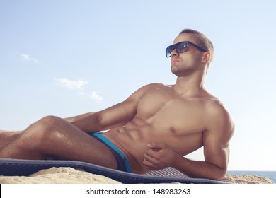 Trendy Perfect Body Guy Posing On The Beach