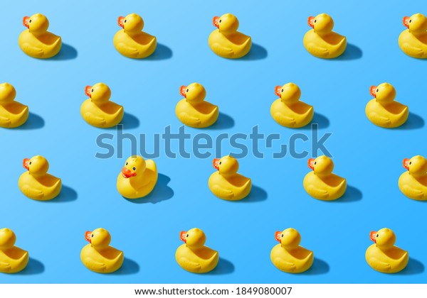 Trendy pop art design of a yellow rubber duck\
pattern from a top view. Dissenting opinion, chosen one, not like\
everyone else.