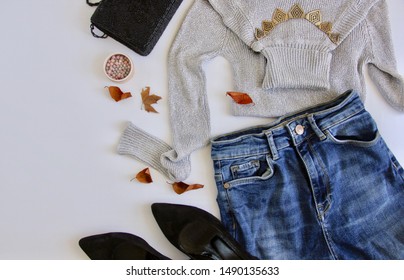 Trendy Set Of Autumnal Female Clothes On White Background. Flay Lay, Top View Composition