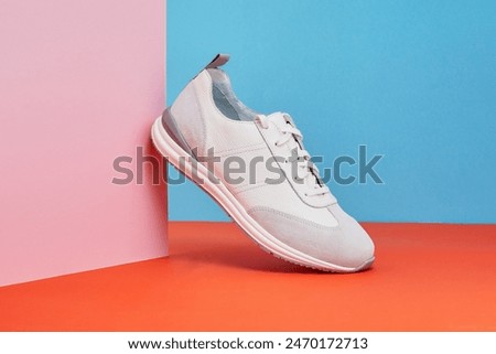 Trendy sneakers shoes isolated on a color background. Pair of fashion male sneakers. Summer street style shoes.