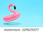 Trendy Summer composition made of pink flamingo inflatable on bright light blue background.Minimal summer concept.Creative art,Contemporary style.Banner background with writing space and copy space.