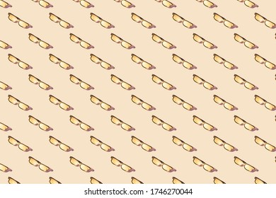 Trendy Summer Seamless pattern.Creative layout gold sunglasses on  beige background.Minimal concept.