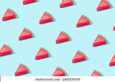 Trendy sunlight Summer pattern made with watermelon fruit on bright light blue background. Minimal summer concept. - Powered by Shutterstock