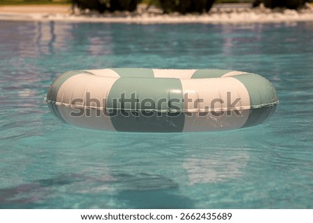 Trendy Turquoise Pool Float in Bright Blue Water