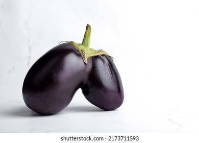 Trendy Ugly Eggplant Isolated On Concrete Grey Background, Funny Aubergine Vegetables For A Healthy Diet With Copy Space, Funny, Unnormal Vegetable Concept