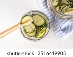 Trendy viral Asian cucumber salad, soy sauce marinated pickled cucumber salad with sesame oil and spices