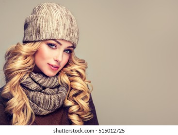 Trendy Warm Winter - Beautiful  Young Blonde  Woman In Gray Wool Winter Hat And Scarf Smiling .  Portrait Of Beauty  Winter Girl  In Knitted  Woolen  Clothing Hat And  Snood . 