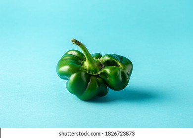 Trendy Weird Ugly Sweet Pepper With Mutations On A Light Blue Background. Organic Farm Vegetables. The Concept Of Zero Waste Production In The Food Industry, A World Without Hunger. Copy Space.