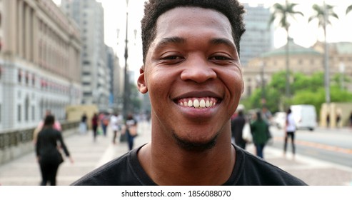 Trendy Young Black African Man Smiling At Camera In Downtown City, Real People