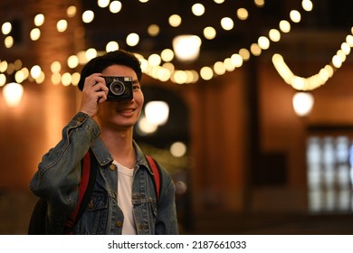 Trendy Young Hipster Man Taking Picture, Enjoying Nightlife In The City