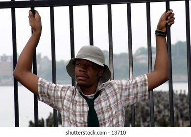 trendy young man near fence