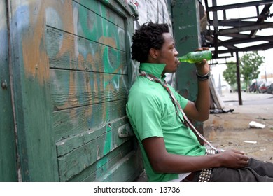 trendy young man near graffiti wall