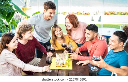 Trendy Young People Having Fun Together Drinking Wine At Penthouse On Private Home Garden - Happy Friends Enjoying Time Together At Restaurant Lounge - Dining Life Style Concept On Bright Vivid Filter