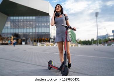 Trendy Young Woman In The City With Her E Scooter 