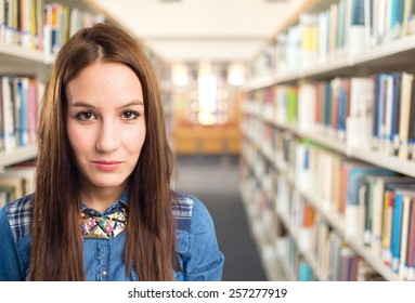 Trendy young woman looking sad. Over library background