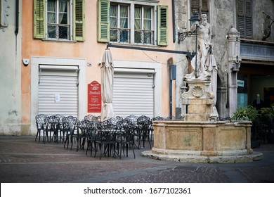 Trentino, Italy - March 2020: Italian Street With Closed Cafe In The Case Of Quarantine Of Pandemic Coronavirus Covid