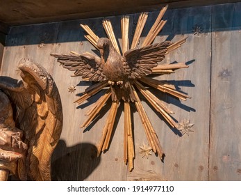 TRENTO, ITALY - JUNE, 1, 2019: carved wooden sculpture of a dove at the annunciation of mary- located at buonconsiglio castle