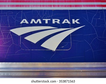 TRENTON, NJ -12 JUNE 2015- Rusty And Cracked Paint Amtrak Logo On The Side Of A Northeast Corridor Train.