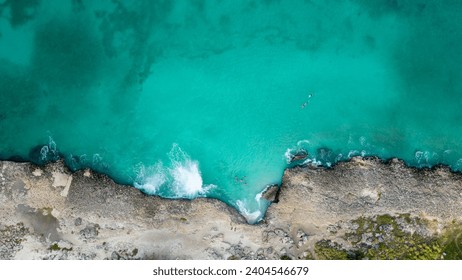 Tres Trapi Aruba, Great beach for diving, with lots of corals, turtles, fish and stingrays. Transparent and turquoise water in the north of the island of Aruba. Drone photo Top View - Powered by Shutterstock