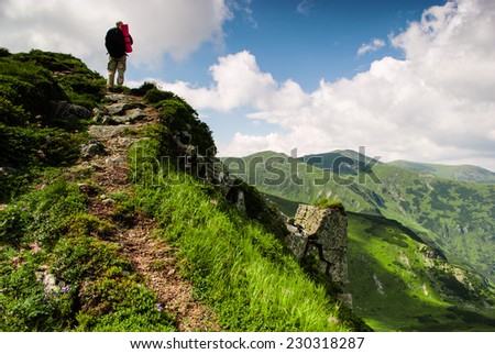 Treveler is hiking into the peak in Carpathian mountians