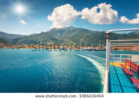 Treveling by ferry from Lefkada island to Kefalonia. Sunny morning seascape of Ionian Sea. Colorful spring view of Nydri town, Greece, Europe. Traveling concept background.
