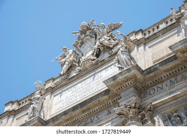 Trevi Fountain Building. Close Up To The Top Sculpture Of Angels