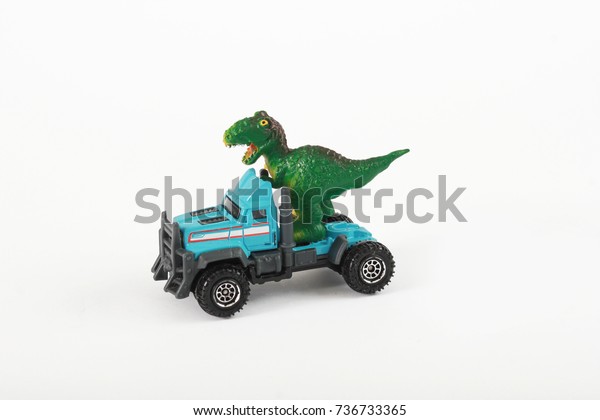 T-Rex toy dinosaur, baby\
toy, isolated on white background, design element, children\'s\
postcard