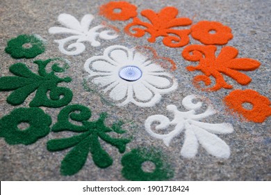 Tri Color Rangoli Of Flower Motif Design Drawn And Coloured On The Occasion Of Indian Republic Day With Ashoka Chakra. Indian Flag Design Theme