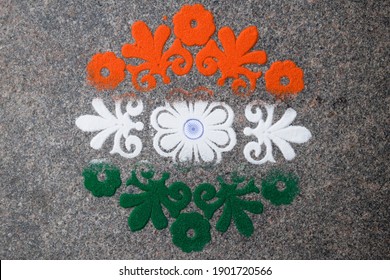 Tri Color Rangoli Of Flower Motif Design Drawn And Coloured On The Occasion Of Indian Republic Day With Ashoka Chakra. Indian Flag Design Theme