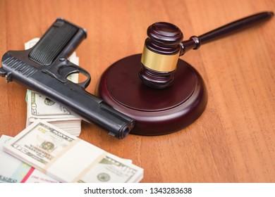 Trial For Robbery With Murder. Murder And Robbery Of Businessman And The Court. Money, Gun And Judge's Gavel On The Table.