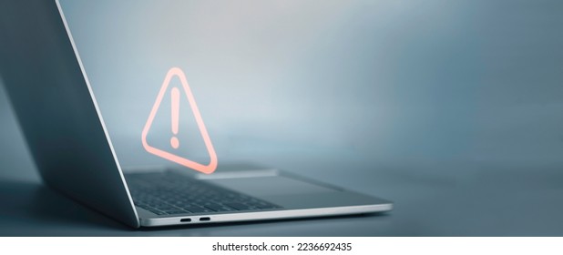 Triangle caution warning sign on laptop screen and Businessman or it staff , programmer, developer using computer for notification problem error 404 and maintenance concept. - Shutterstock ID 2236692435