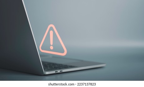 Triangle caution warning sign on laptop screen and Businessman or it staff , programmer, developer using computer for notification problem error 404 and maintenance concept. - Shutterstock ID 2237137823