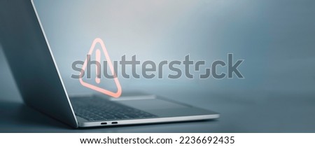 Triangle caution warning sign on laptop screen and Businessman or it staff , programmer, developer using computer for notification problem error 404 and maintenance concept.