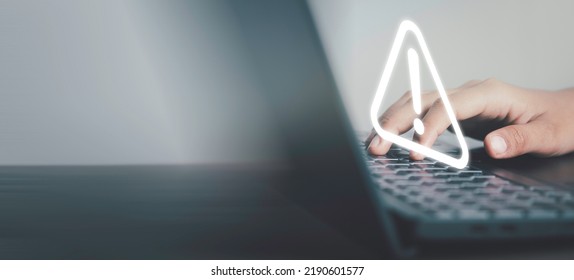 Triangle caution warning sing on laptop screen and Businessman using. Problem for notification error 404 and maintenance service alarm or beware hazard in internet network concept. - Shutterstock ID 2190601577