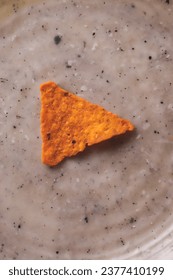 A triangle corn dorito kept on a place