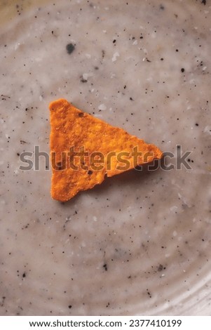 A triangle corn dorito kept on a place