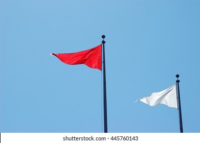 Triangle Flag Against Blue Sky