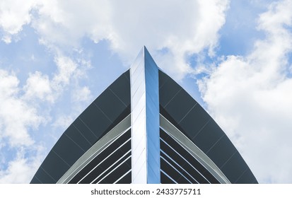 Triangle high view building structure facade rooftop blue sky background in cityscape well architecture modern style