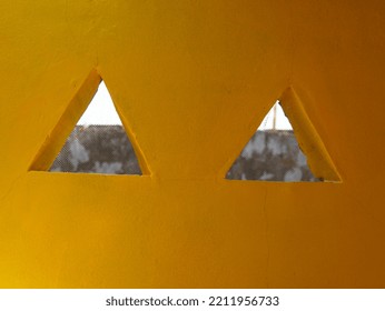 Triangle House Ventilation On Yellow Wall