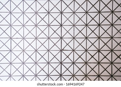 Triangle pattern white ceramic tiles on the floor