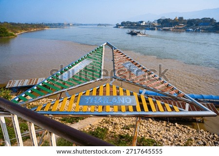 The triangular border marker at the confluence of the Mekong and Ruak rivers in the Golden Triangle Park (Sop Ruak) in Chiang Saen in Northern Thailand